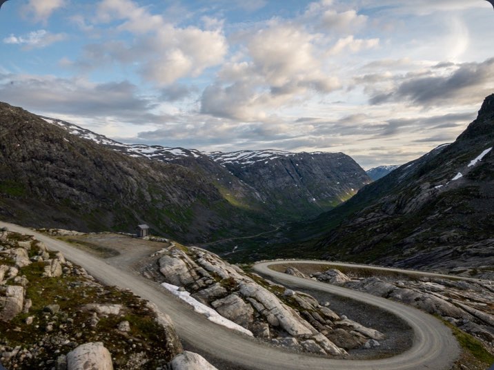 Photo of winding road snaking down a hill